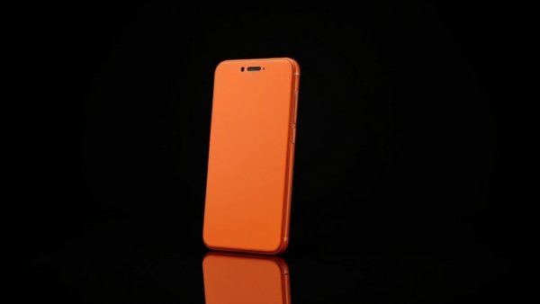 Sleek orange phone with AI update, standing on reflective surface.