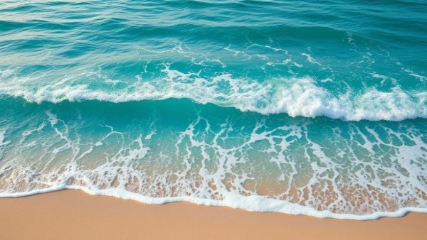 Yamily Castillo Art seascape, ocean meeting sandy beach with vibrant waves.