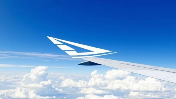 AirlineGeeks logo with airplane wing and cloud backdrop.