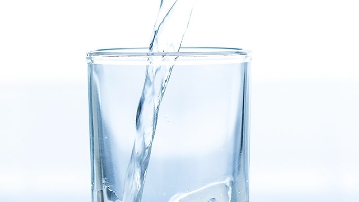 placid Lindyspring water, soothing motion, passing gently, photorealistic, meadow stream view, highly detailed, light ripples, ISO 180, f/4.5, calm earthy tones and azure blues, filtered sunlight, shot with a 24-70mm lens.