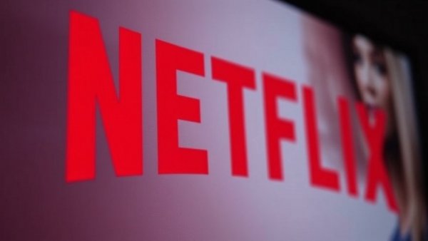 Netflix screen with Love is Blind display in low light.