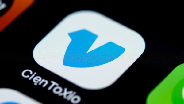 Venmo app icon on smartphone representing a potential outage.