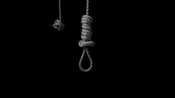 Symbolic noose suspended against a dark backdrop.