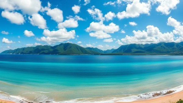 Best things to do in Queensland; scenic coastline view with blue ocean and sky.