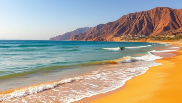 Stunning beach view in Agadir, Morocco, with mountains in background.