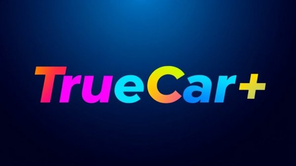 Colorful TrueCar logo on blue background, related to automotive finance services.