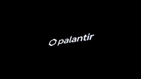 Close-up smartphone showing Palantir logo in dark setting
