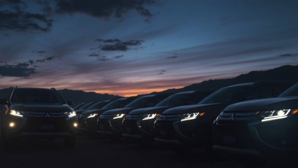 Mitsubishi car lineup at dusk showcasing new U.S. plan