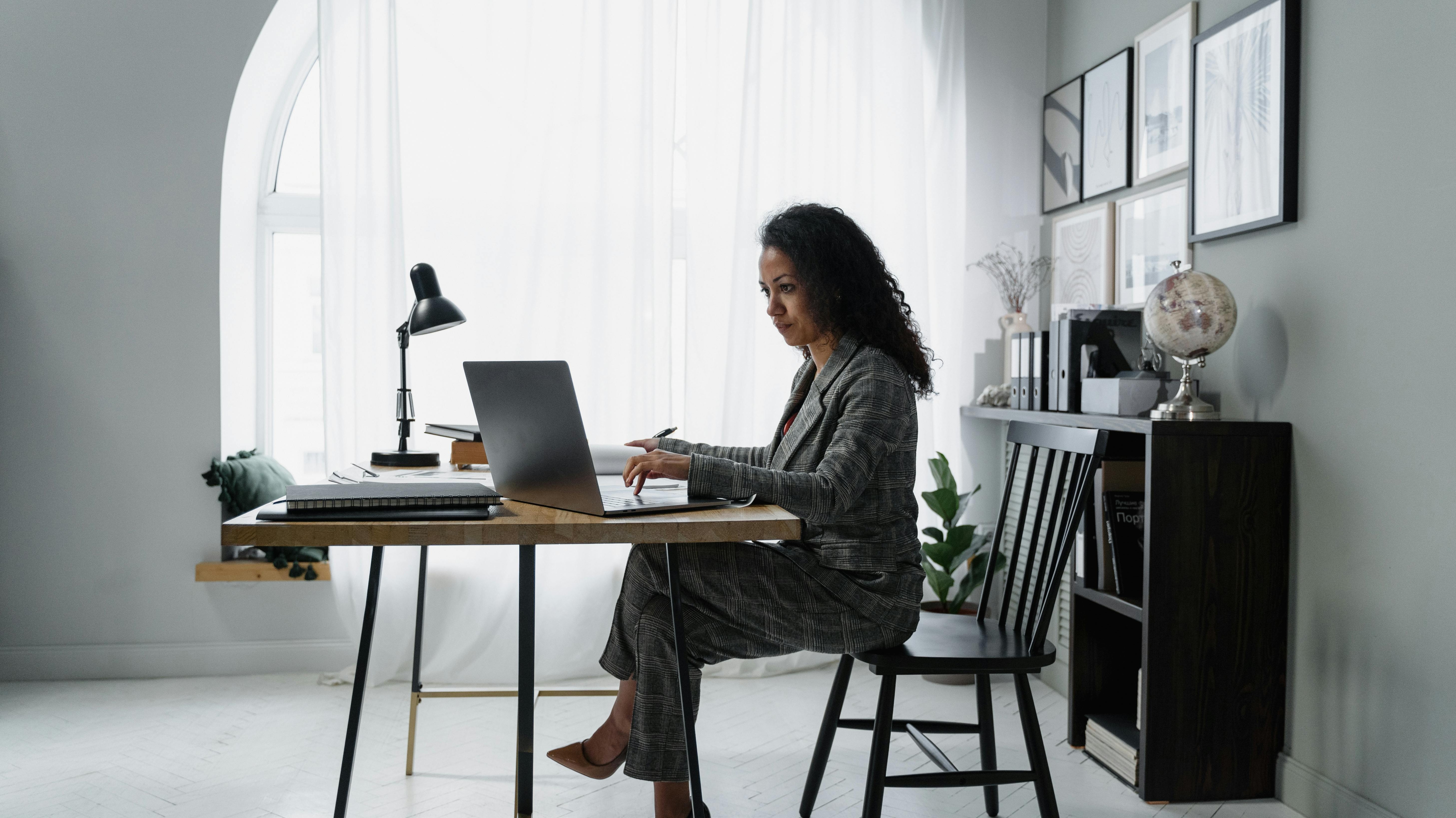 banker explaining money growth strategies, intelligent expression, utilizing multiple screens, photorealistic, sleek urban office environment, highly detailed, real-time financial data, sharp focus, cool color scheme, LED lighting, shot with a 24-70mm lens