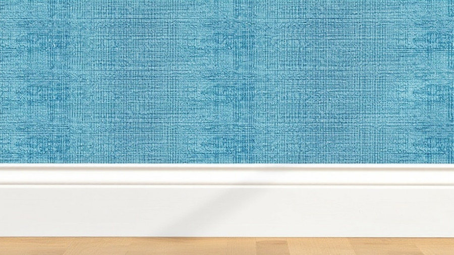 Grasscloth wallpaper installation detail with blue texture and baseboard.