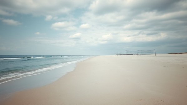Serene beach view with calm waves under cloudy sky, rental fashion trend.