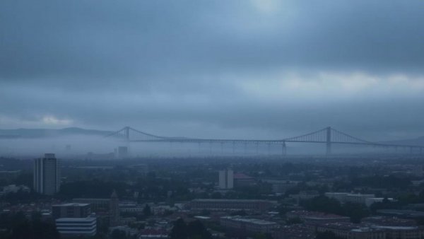 Hazy San Jose skyline with distant bridge under Spare the Air Alert.