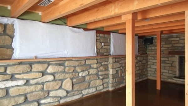 Insulating rim joists in a wet basement with rubble stone foundation