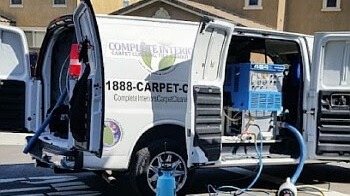 truck mount carpet cleaning equipment outside an office