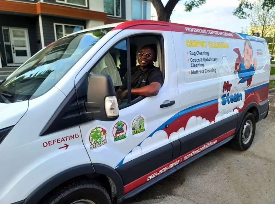 Mr. Steam Franchise System cleaning van with driver.