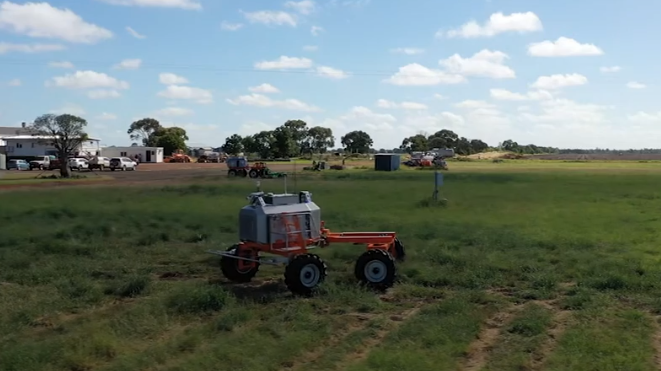 Driverless SwarmFarm Robotics harvester for sustainable agriculture technology.