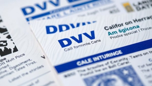 Close-up of California DMV documents highlighting text and security features.