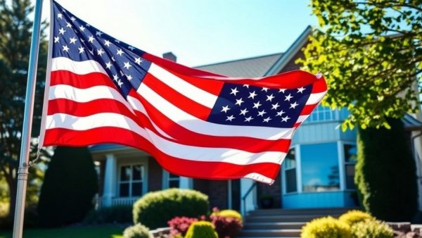 American flag in front of suburban home, patriotic symbol.