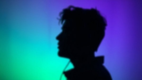 Blurry silhouette with headphones highlighting audio over YouTube ads.