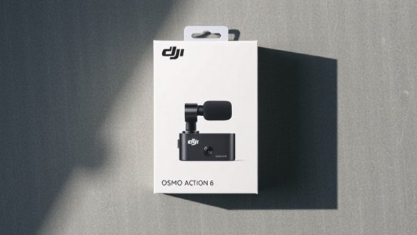 Minimalist DJI Osmo Action 6 camera box on gray surface.