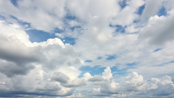 Dramatic clouds revealing a patch of blue sky, symbolizing IoT device vulnerabilities cloud management.