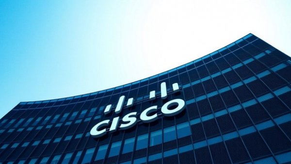 Modern Cisco building exterior under blue sky, representing technology advancements.