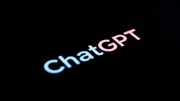 ChatGPT app logo close-up on smartphone showing glowing interface.