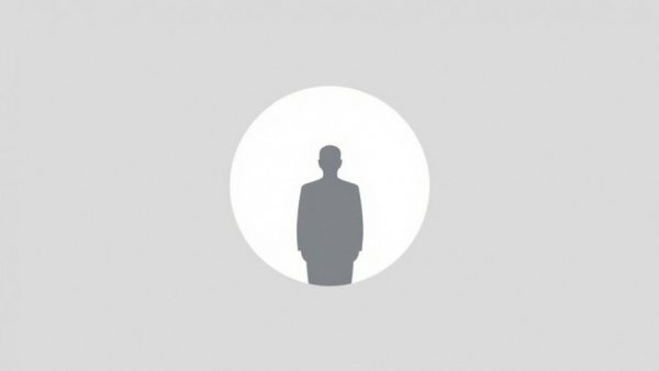 Minimalist icon of person silhouette on gray background.