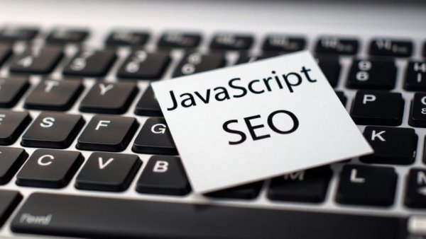 JavaScript SEO update note on keyboard, close-up.