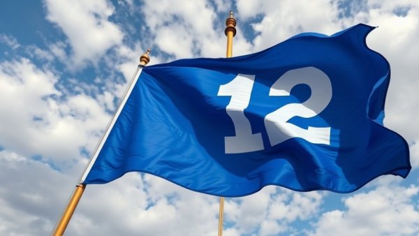 Blue flag with number 12 blowing against a clear sky
