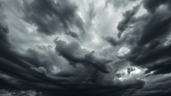 Dark storm clouds swirling in a dramatic sky, evoking intensity.