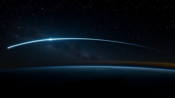 Brilliant meteor in night sky during December celestial event in Columbus.