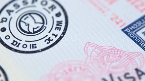 Visa passport close-up highlights travel restrictions.