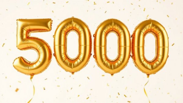 Celebratory gold balloons for 5000 with confetti.