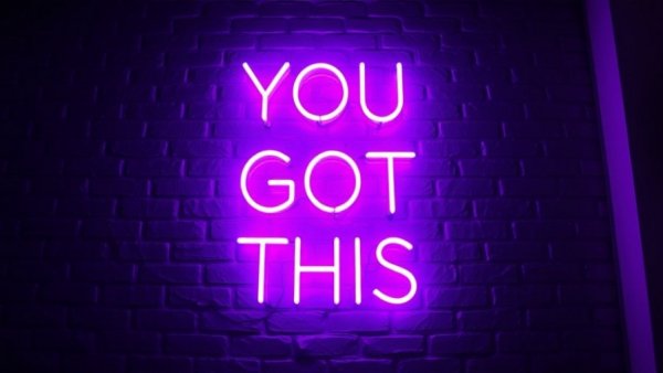 Neon sign reading 'YOU GOT THIS' on a black brick wall.
