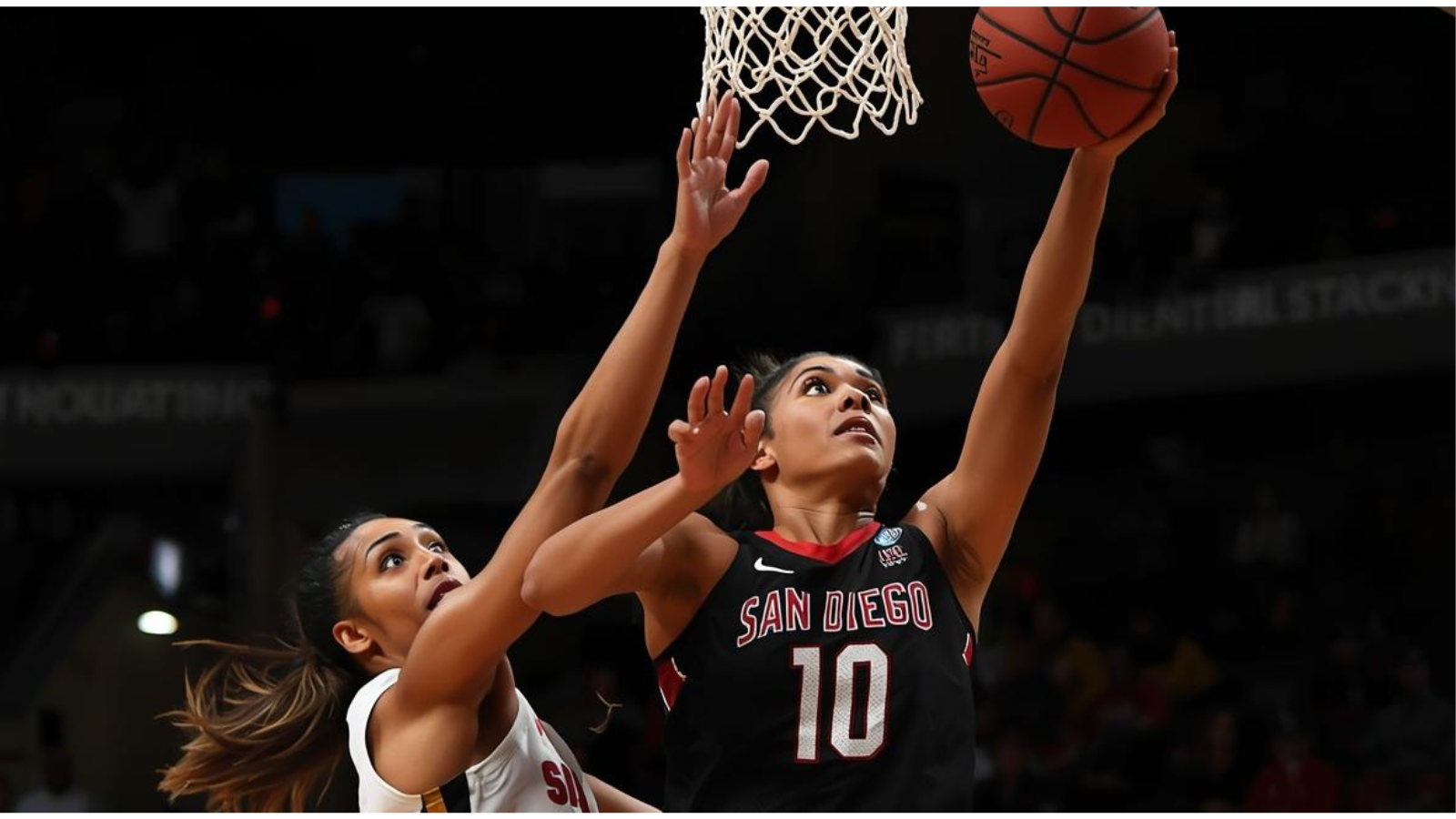 Intense basketball game action at SDSU UCSD women basketball conference.