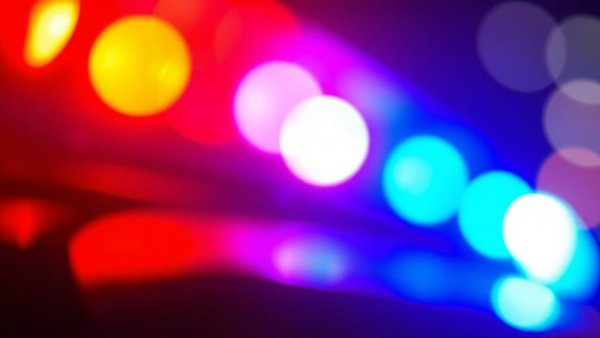 Abstract police siren lights with red and blue glow, blurred effect.