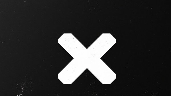 Minimalist white 'X' logo on black grunge background.