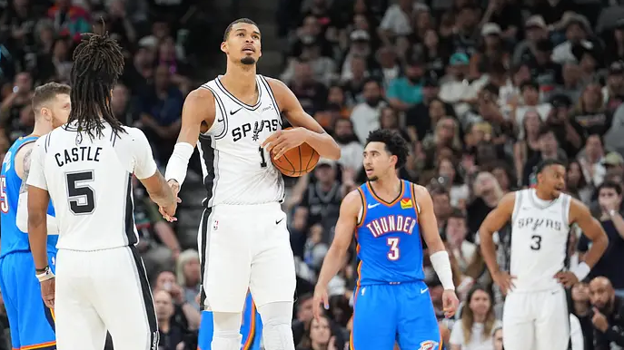 San Antonio Spurs game promotional graphic with two players and game details.