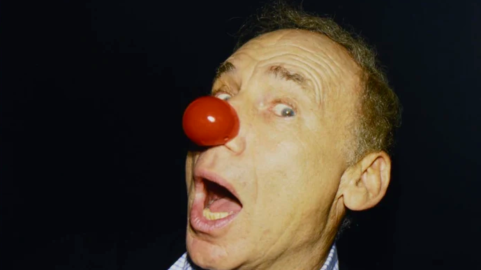 Mel Brooks discussing his comedy legends legacy in a warm, detailed setting.