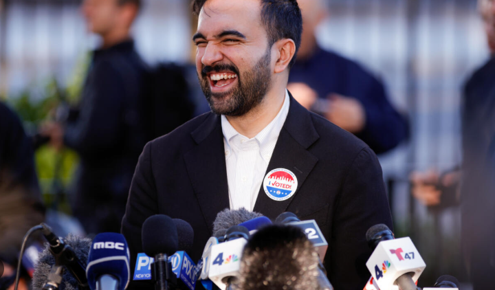 Diverse political discussion image with two figures representing Tax The Rich.