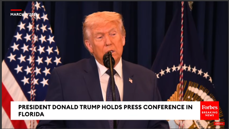 Mature male speaker addressing audience, highlighting news in the US.