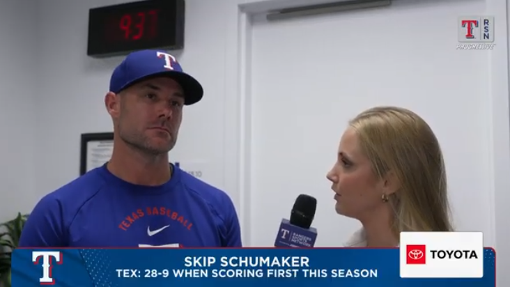 Coach discussing baseball strategy insights in an interview.