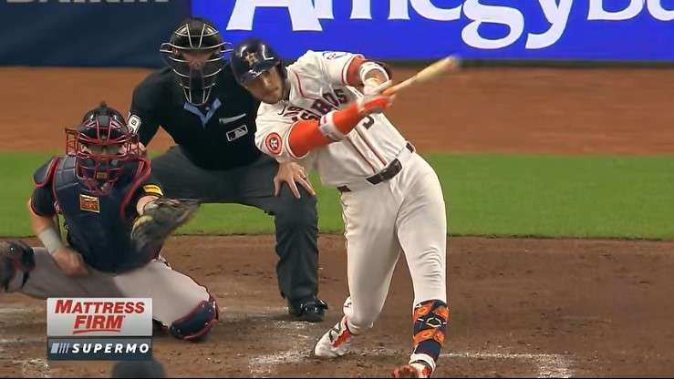 Walk-off wins in baseball celebration, player raising arm, blurred crowd.