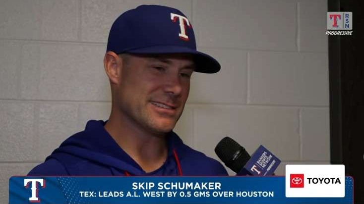 Skip Schumaker game analysis interview with reporter, casual setting.