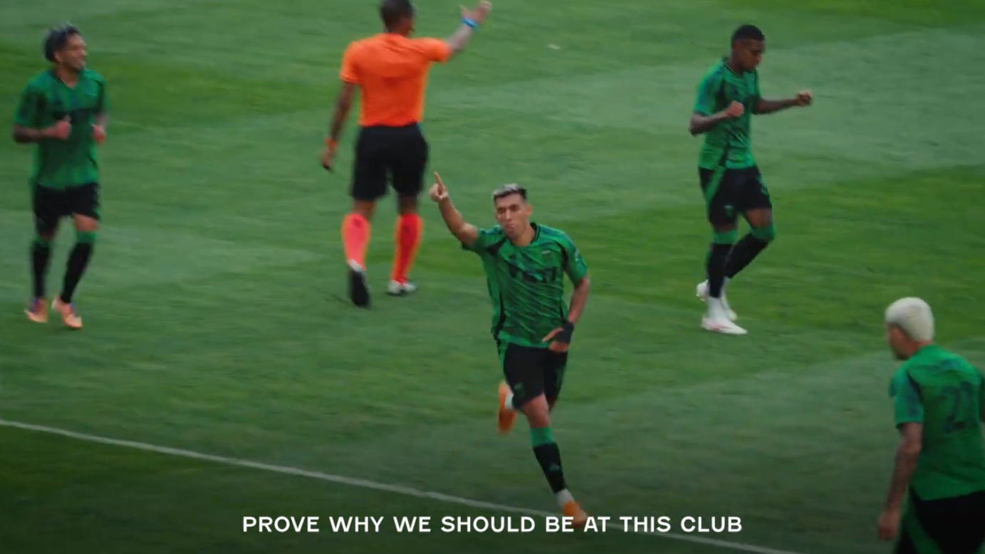 Austin FC players in a huddle preparing for playoff match.