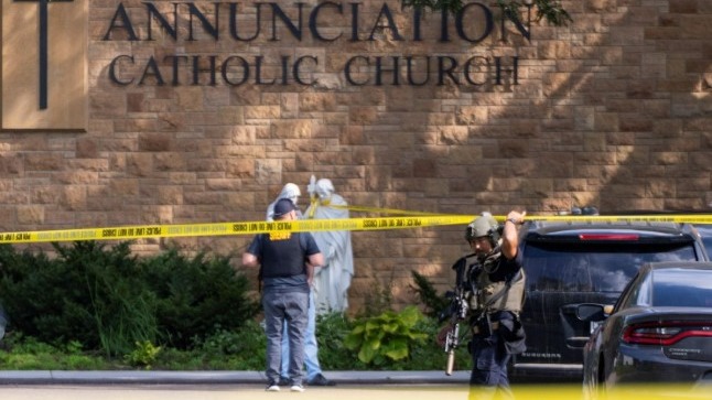 Memorial scene with messages and wreath for Minneapolis school shooting.