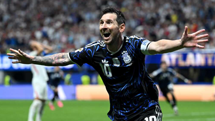 Messi assists Argentina in FIFA World Cup Final, intense action.