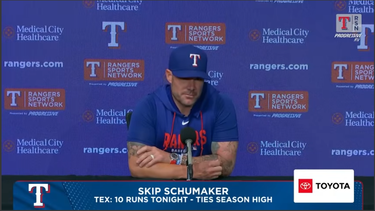 Young man discussing leadership in baseball at press conference.