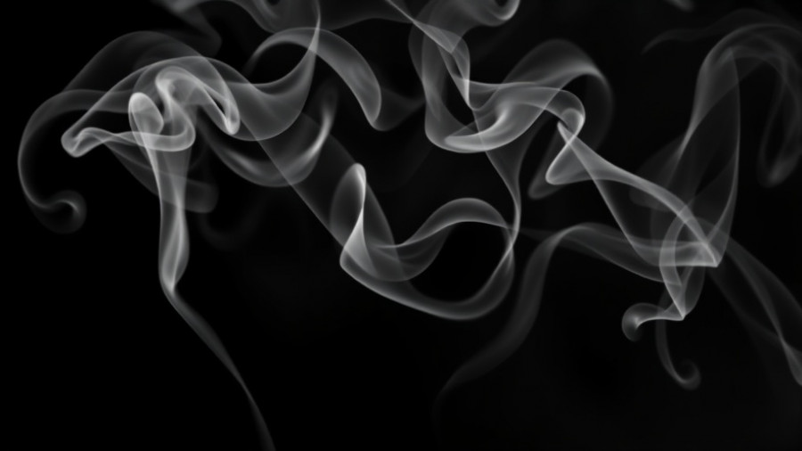 Generational tobacco ban Maldives concept with swirling smoke.